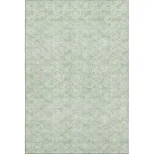 Photo of Mint Green And Ivory Polka Dot Washable Area Rug With UV Protection