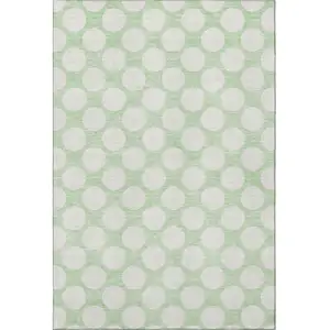 Photo of Mint Green And Ivory Polka Dot Washable Area Rug With UV Protection