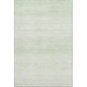 Photo of Mint Green And Ivory Striped Washable Area Rug With UV Protection