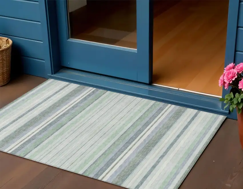 Mint Green And Ivory Striped Washable Indoor Outdoor Area Rug Photo 1