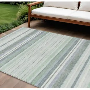 Photo of Mint Green And Ivory Striped Washable Indoor Outdoor Area Rug