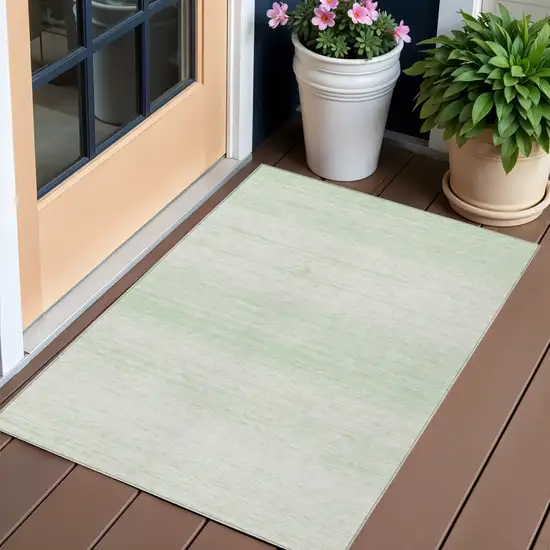 Mint Green And Ivory Striped Washable Indoor Outdoor Area Rug Photo 1