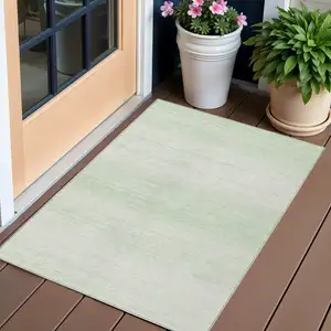Photo of Mint Green And Ivory Striped Washable Indoor Outdoor Area Rug