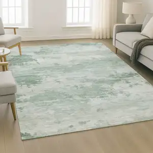 Photo of Mint Green And Pale Aqua Abstract Washable Area Rug With UV Protection