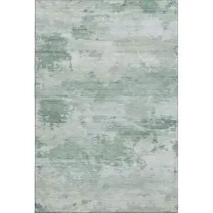 Photo of Mint Green And Pale Aqua Abstract Washable Area Rug With UV Protection