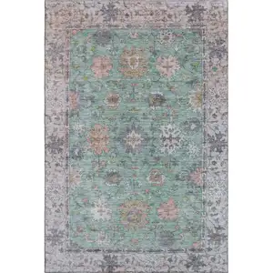 Photo of Mint Green And Peach Oriental Washable Area Rug With UV Protection