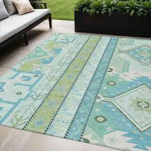 Photo of Mint Green Blue And Ivory Aztec Washable Indoor Outdoor Area Rug