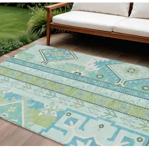 Photo of Mint Green Blue And Ivory Aztec Washable Indoor Outdoor Area Rug