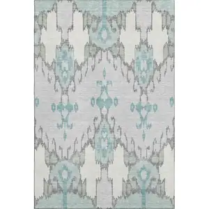 Photo of Mint Green Blue And Ivory Ikat Washable Area Rug With UV Protection