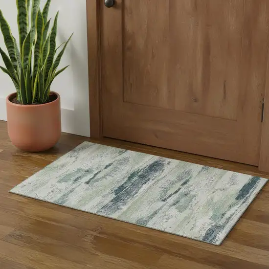 Mint Green Ivory And Blue Abstract Washable Area Rug With UV Protection Photo 1