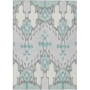 Photo of Mint Green Teal Blue And Ivory Ikat Washable Indoor Outdoor Area Rug