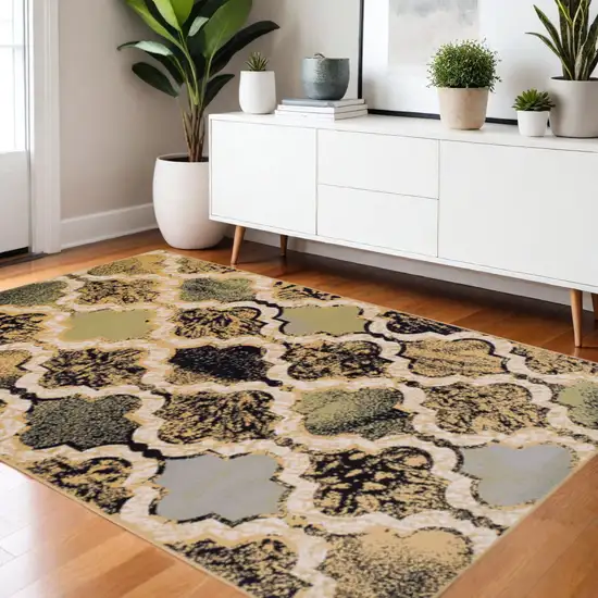 Black And Ivory Quatrefoil Distressed Area Rug Photo 1