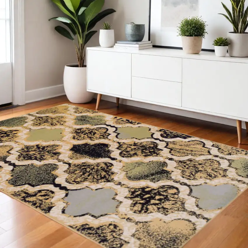 Black And Ivory Quatrefoil Distressed Area Rug Photo 1