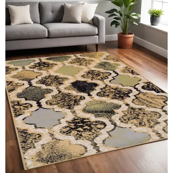 Black And Ivory Quatrefoil Distressed Area Rug Photo 1