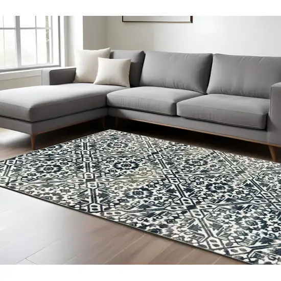 Navy Blue And Ivory Geometric Distressed Area Rug Photo 1