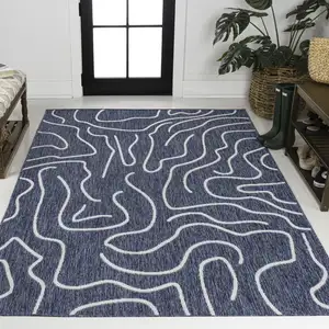 Photo of Navy Blue And Cream Abstract Indoor Outdoor Area Rug