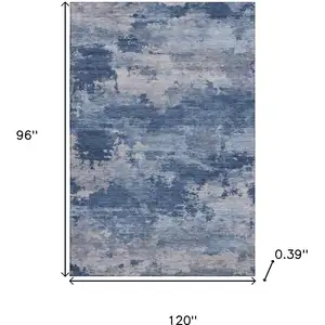 Photo of Navy Blue And Denim Blue Abstract Washable Area Rug With UV Protection