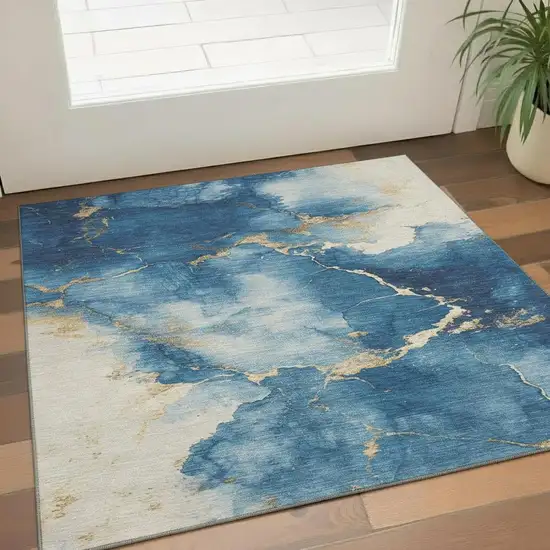 Navy Blue And Gold Abstract Washable Area Rug With UV Protection Photo 2