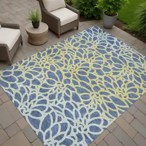 Photo of Navy Blue And Gold Botanical Leaves Washable Indoor Outdoor Area Rug