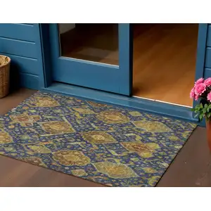Photo of Navy Blue And Gold Ikat Washable Indoor Outdoor Area Rug