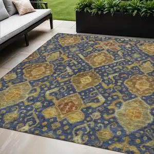 Photo of Navy Blue And Gold Ikat Washable Indoor Outdoor Area Rug