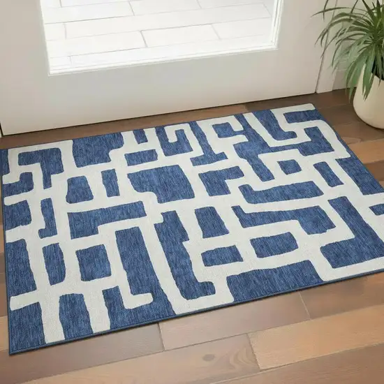Navy Blue And Ivory Abstract Geometric Washable Area Rug With UV Protection Photo 1