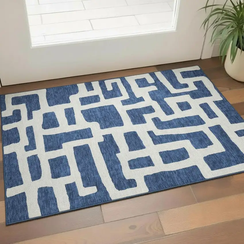 Navy Blue And Ivory Abstract Geometric Washable Area Rug With UV Protection Photo 1