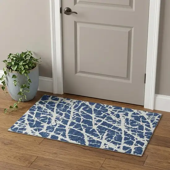 Navy Blue And Ivory Abstract Washable Area Rug With UV Protection Photo 1