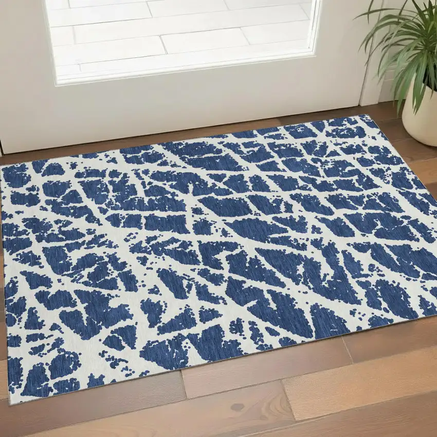 Navy Blue And Ivory Abstract Washable Area Rug With UV Protection Photo 1