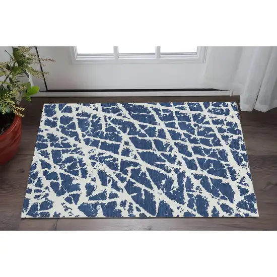 Navy Blue And Ivory Abstract Washable Area Rug With UV Protection Photo 2