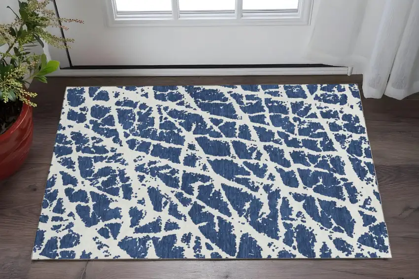Navy Blue And Ivory Abstract Washable Area Rug With UV Protection Photo 2