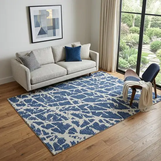 Navy Blue And Ivory Abstract Washable Area Rug With UV Protection Photo 1