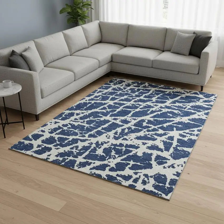 Navy Blue And Ivory Abstract Washable Area Rug With UV Protection Photo 1