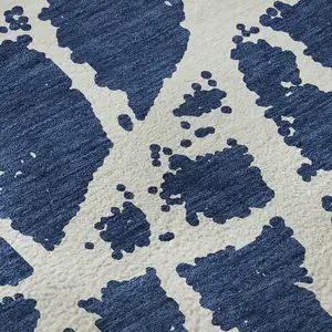 Photo of Navy Blue And Ivory Abstract Washable Area Rug With UV Protection