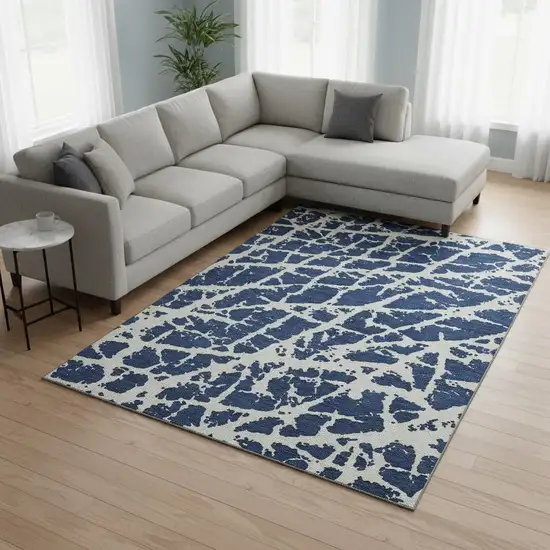 Navy Blue And Ivory Abstract Washable Area Rug With UV Protection Photo 1
