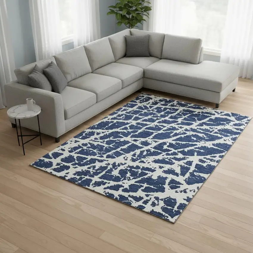 Navy Blue And Ivory Abstract Washable Area Rug With UV Protection Photo 1