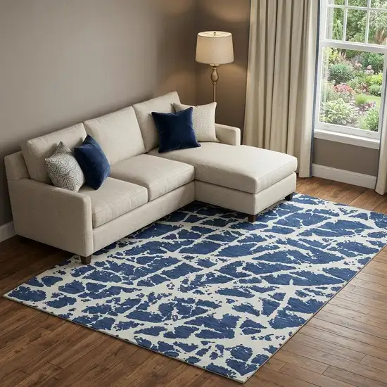 Navy Blue And Ivory Abstract Washable Area Rug With UV Protection Photo 1