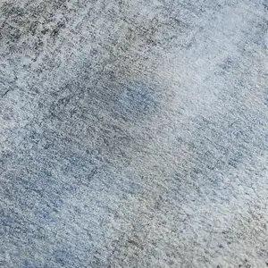 Photo of Navy Blue And Ivory Abstract Washable Area Rug With UV Protection