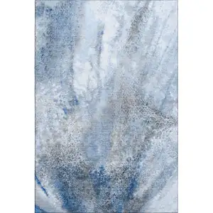 Photo of Navy Blue And Ivory Abstract Washable Area Rug With UV Protection