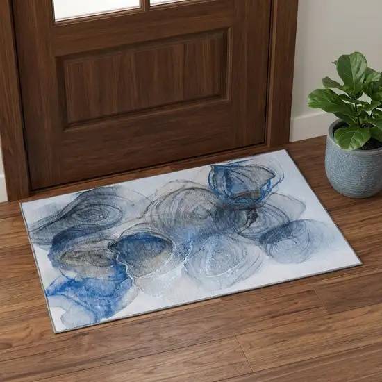 Navy Blue And Ivory Abstract Washable Area Rug With UV Protection Photo 1