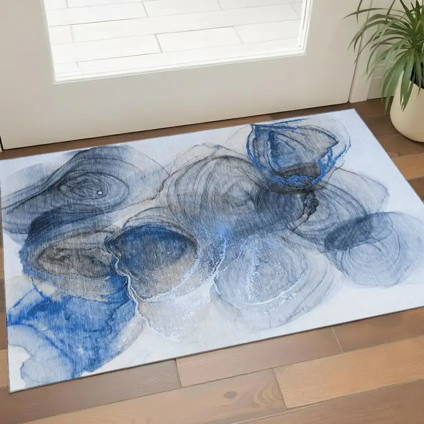 Navy Blue And Ivory Abstract Washable Area Rug With UV Protection Photo 1