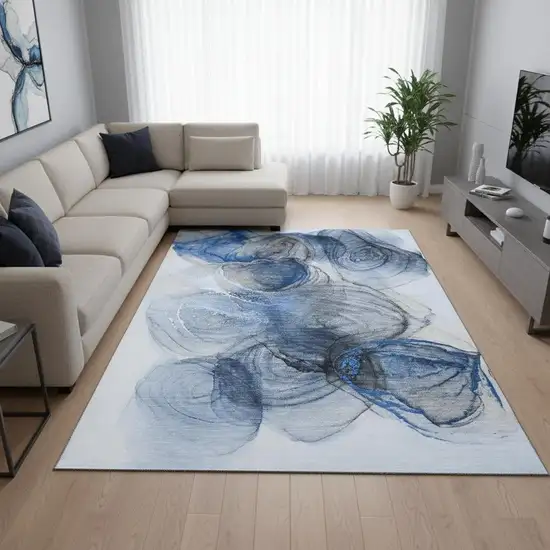Navy Blue And Ivory Abstract Washable Area Rug With UV Protection Photo 1