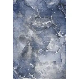 Photo of Navy Blue And Ivory Abstract Washable Area Rug With UV Protection