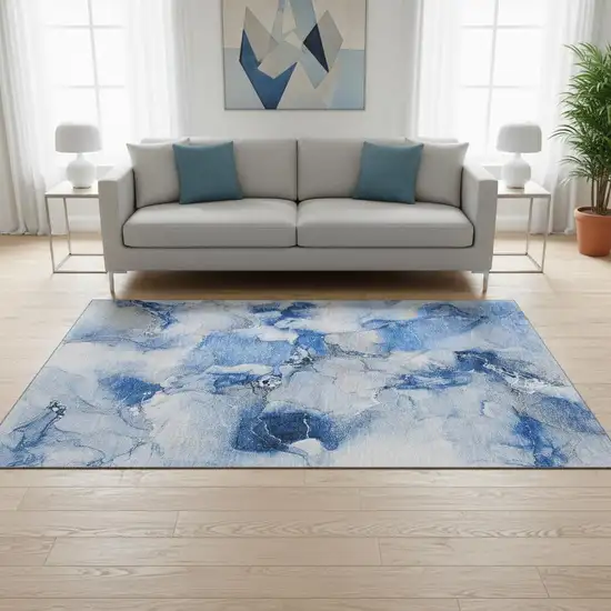 Navy Blue And Ivory Abstract Washable Area Rug With UV Protection Photo 1