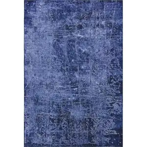 Photo of Navy Blue And Ivory Abstract Washable Area Rug With UV Protection