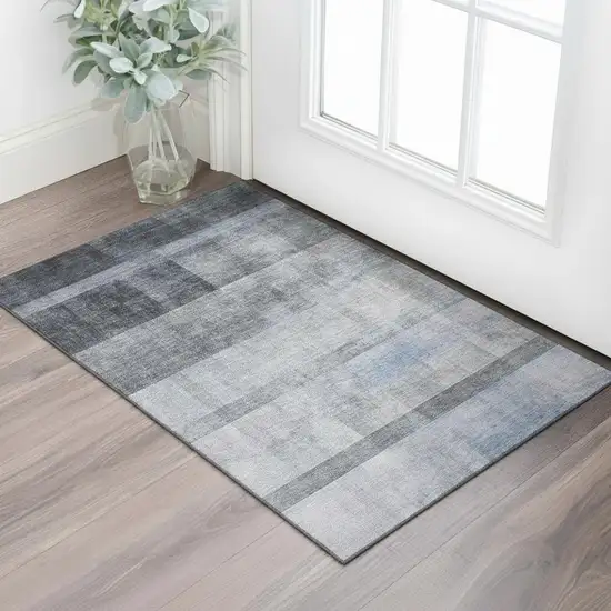 Navy Blue And Ivory Abstract Washable Area Rug With UV Protection Photo 1