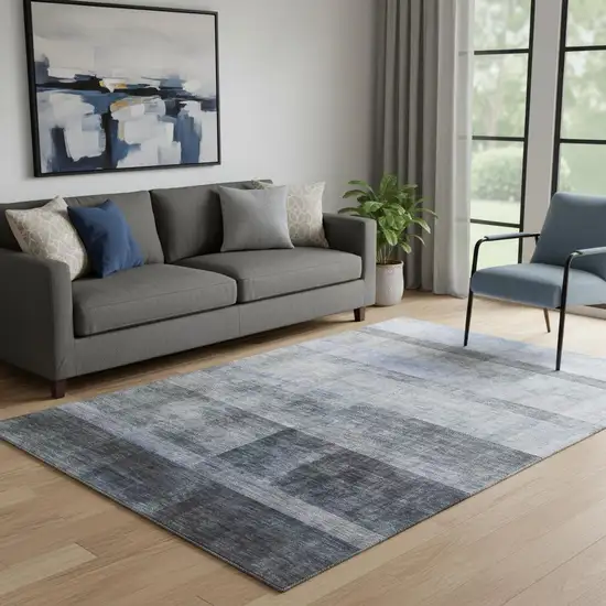 Navy Blue And Ivory Abstract Washable Area Rug With UV Protection Photo 1