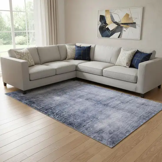 Navy Blue And Ivory Abstract Washable Area Rug With UV Protection Photo 1