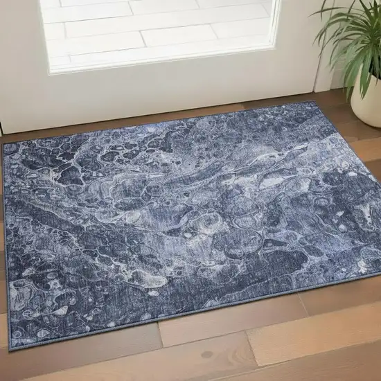 Navy Blue And Ivory Abstract Washable Area Rug With UV Protection Photo 1