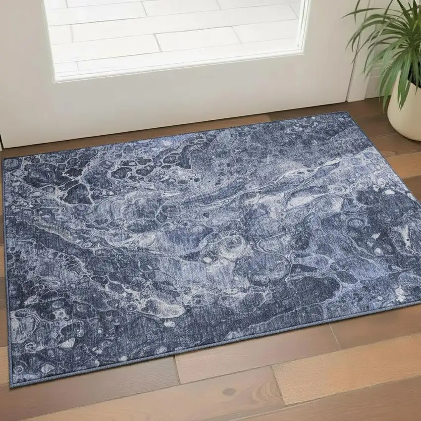Navy Blue And Ivory Abstract Washable Area Rug With UV Protection Photo 1